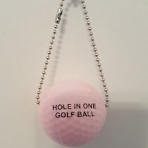 A unique hole in one golf ball  key chain.